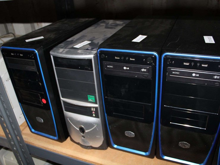 three-shelves-of-desktop-computers,-printers,-&-flat-screen-monitors-image-4