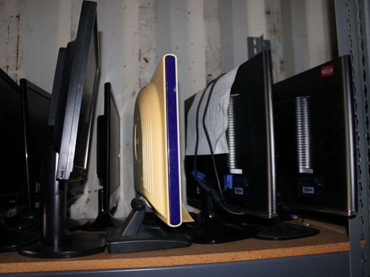 three-shelves-of-desktop-computers,-printers,-&-flat-screen-monitors-image-2
