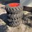 set-of-4-unused-10-16.5n.h.s.-forerunner-skid-steer-wheels-and-tires-image-3