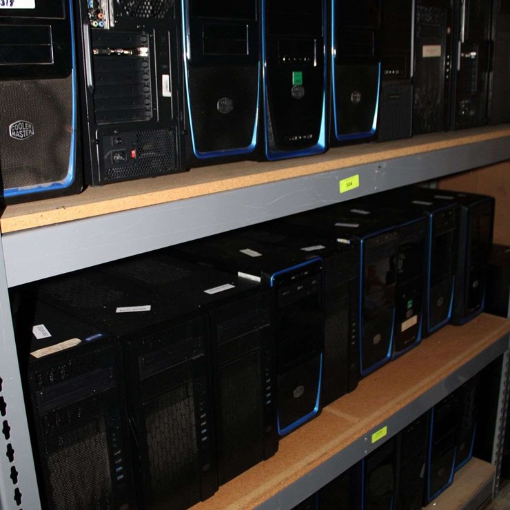 THREE SHELVES OF DESKTOP COMPUTERS