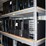 four-shelves-of-desktop-computers-&-laptop-computers-image-1