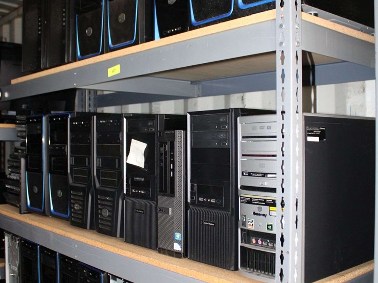 four-shelves-of-desktop-computers-&-laptop-computers-image-1