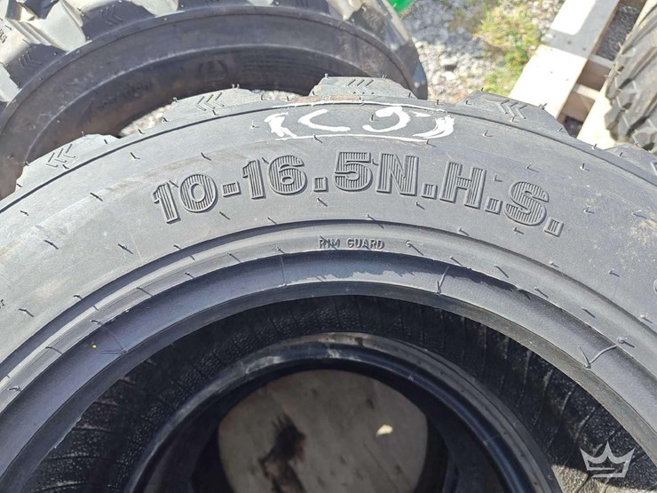 set-of-4-unused-10-16.5n.h.s.-forerunner-skid-steer-tires-image-2