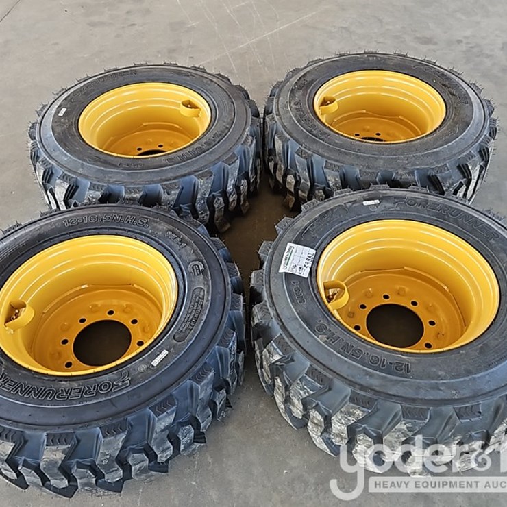 Unused 12-16.5 Tires c/w Wheels to suit New Holland, John Deere, CAT Skidsteer (4 of)