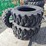 set-of-4-unused-10-16.5n.h.s.-forerunner-skid-steer-tires-image-3