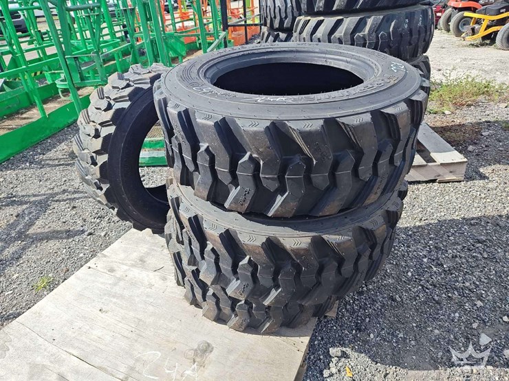 set-of-4-unused-10-16.5n.h.s.-forerunner-skid-steer-tires-image-3