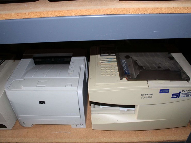 three-shelves-of-desktop-computers,-printers,-&-flat-screen-monitors-image-7