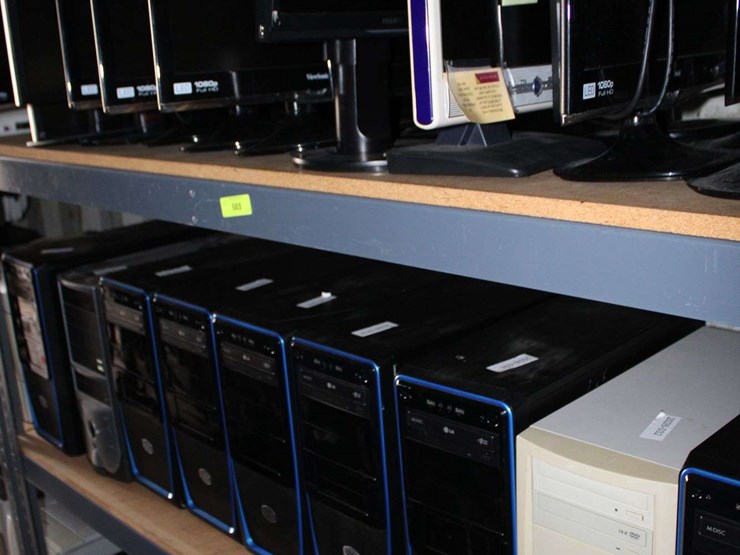 three-shelves-of-desktop-computers,-printers,-&-flat-screen-monitors-image-1