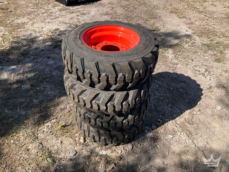 set-of-4-unused-10-16.5n.h.s.-forerunner-skid-steer-wheels-and-tires-image-2