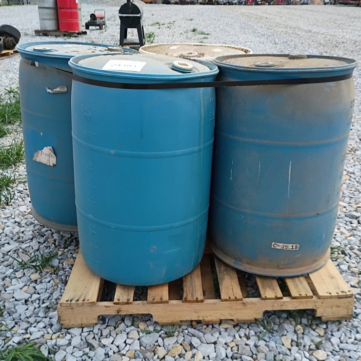 #24393 • Pallet of Plastic Barrels
