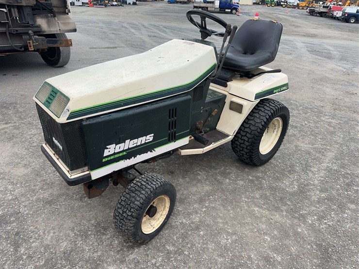 bolens-diesel-lawn-tractor-with-50”-mower-deck,-48”-blower-and-box-of-attachments-image-1