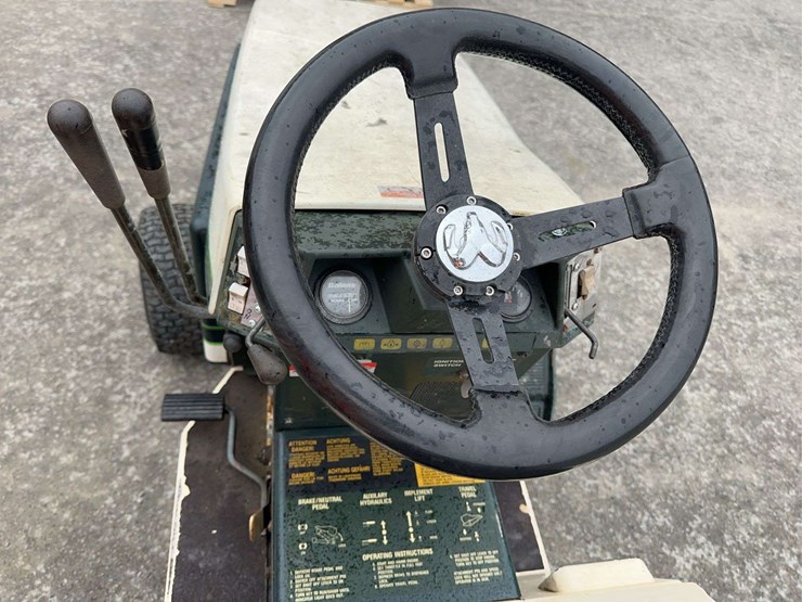 bolens-diesel-lawn-tractor-with-50”-mower-deck,-48”-blower-and-box-of-attachments-image-13