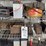 assorted-garage-shelf-contents-including-automotive-fluids,-batteries,-charger,-and-accessories-image-4