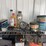 assorted-garage-shelf-contents-including-automotive-fluids,-batteries,-charger,-and-accessories-image-2
