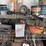 assorted-garage-shelf-contents-including-automotive-fluids,-batteries,-charger,-and-accessories-image-3