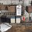 assorted-garage-shelf-contents-including-automotive-fluids,-batteries,-charger,-and-accessories-image-5