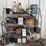 assorted-garage-shelf-contents-including-automotive-fluids,-batteries,-charger,-and-accessories-image-1