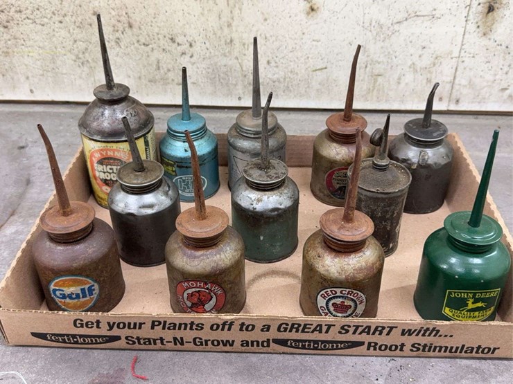oil-can-assortment-with-advertising-graphics-image-1