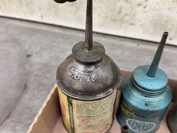 oil-can-assortment-with-advertising-graphics-image-7