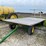 john-deere-1065-hay-rack-wagon,-10-ton-running-gear-image-2