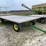 john-deere-1065-hay-rack-wagon,-10-ton-running-gear-image-1