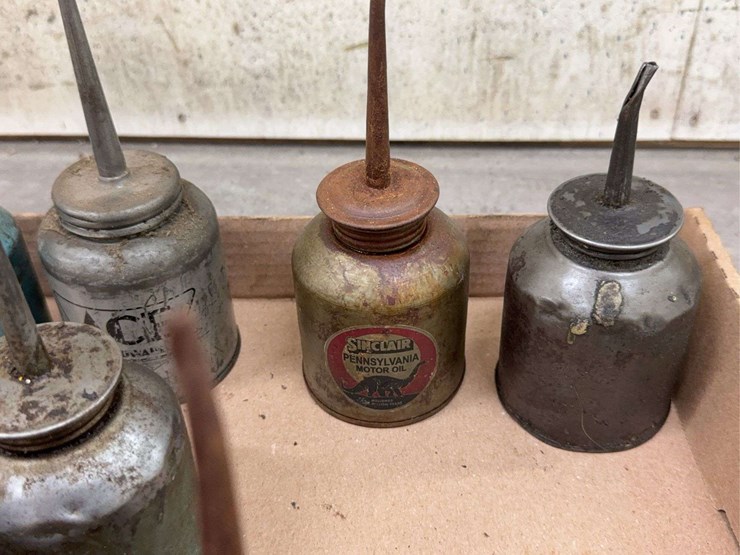 oil-can-assortment-with-advertising-graphics-image-4