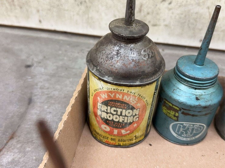 oil-can-assortment-with-advertising-graphics-image-6