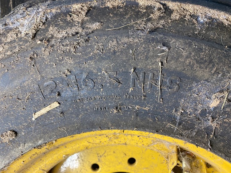 #3558-•-(4)-caterpillar-skid-steer-tires-on-rims-image-5