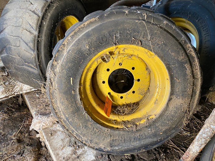 #3558-•-(4)-caterpillar-skid-steer-tires-on-rims-image-2