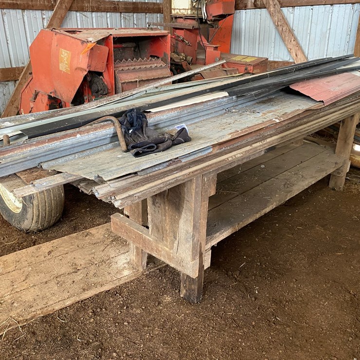 #3593 • Wooden Work Bench with Assortment of Sheet Metal Siding