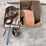 assorted-collection-of-belts,-pulleys,-and-metal-parts-image-1