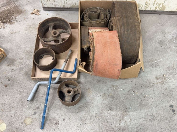 assorted-collection-of-belts,-pulleys,-and-metal-parts-image-1