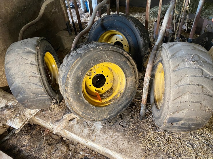 #3558-•-(4)-caterpillar-skid-steer-tires-on-rims-image-1