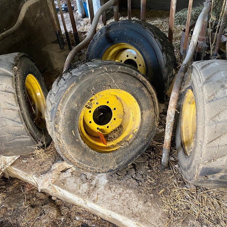 #3558 • (4) Caterpillar Skid-Steer Tires on Rims