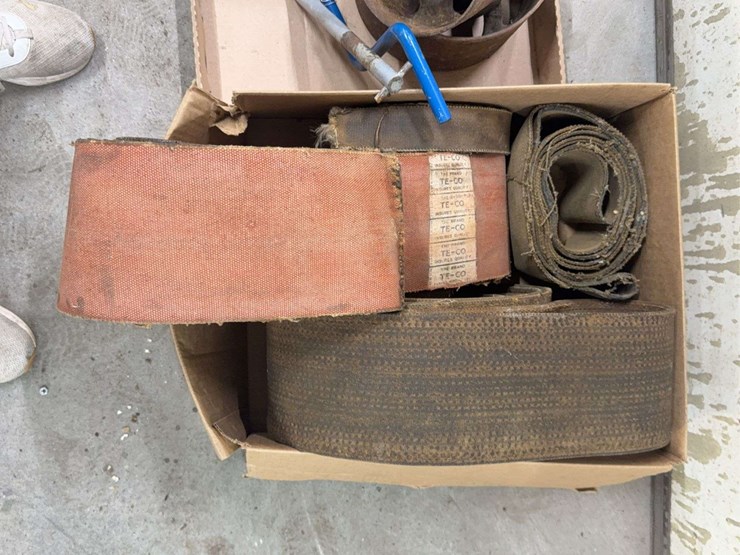 assorted-collection-of-belts,-pulleys,-and-metal-parts-image-9