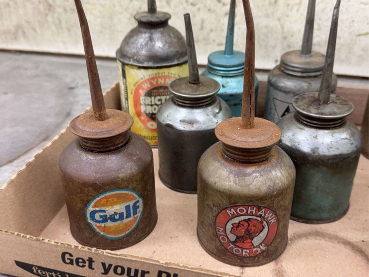oil-can-assortment-with-advertising-graphics-image-8