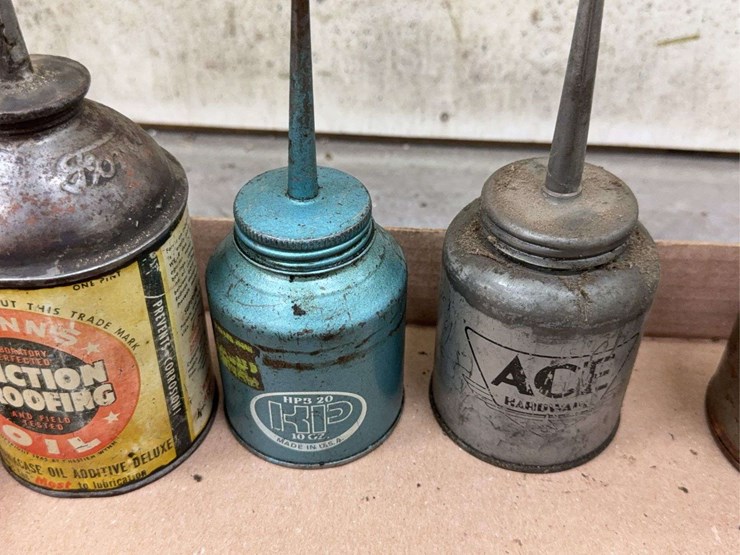 oil-can-assortment-with-advertising-graphics-image-5