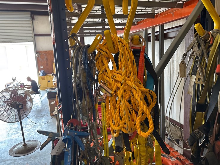 #4098-•-rack-of-climbing-safety-harnesses-image-6