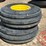pair-of-11.00-16-triple-rib-tires-on-8-hole-wheels-image-1