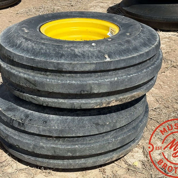 Pair of 11.00-16 Triple Rib Tires on 8-Hole Wheels
