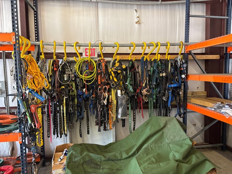 #4098-•-rack-of-climbing-safety-harnesses-image-1