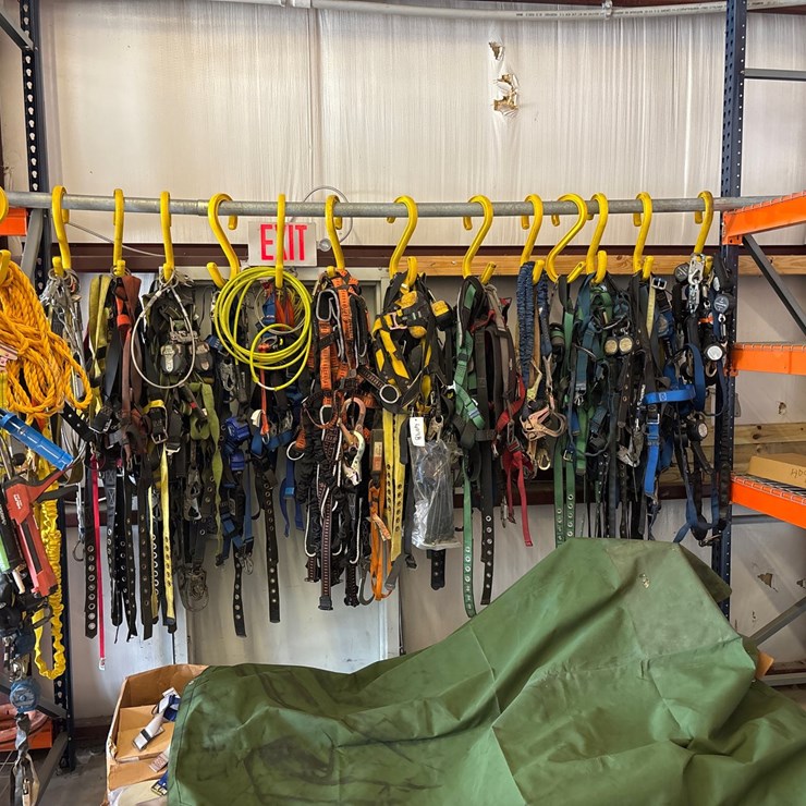 #4098 • RACK OF CLIMBING SAFETY HARNESSES