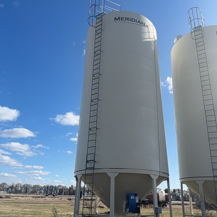 Meridian 6000 bushel hopper bin with fan, used for grain only, excellent shape