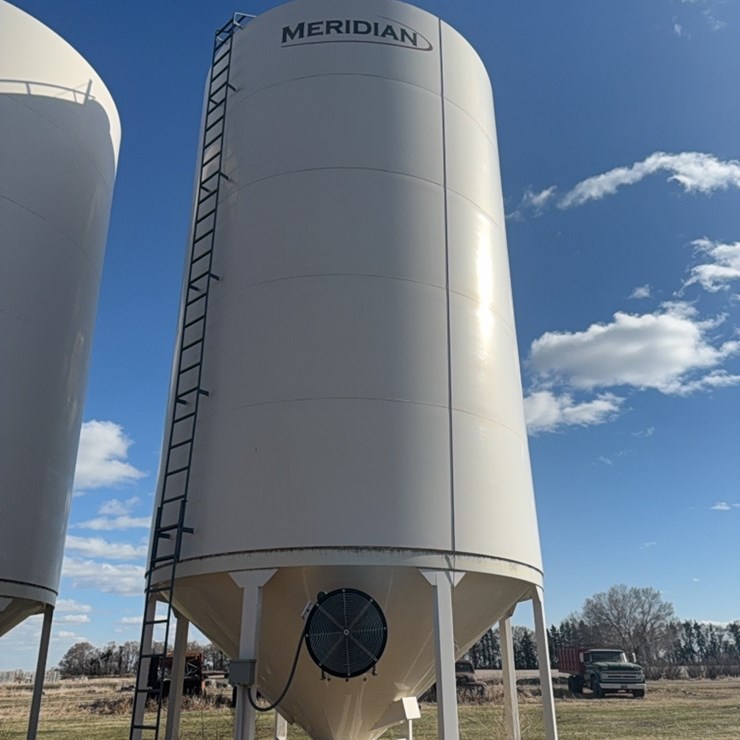 Meridian 5000 bushel hopper bin with fan, this bin is designed for fertilizer, however it has never had fertilizer in it. Grain only. Excellent shape.