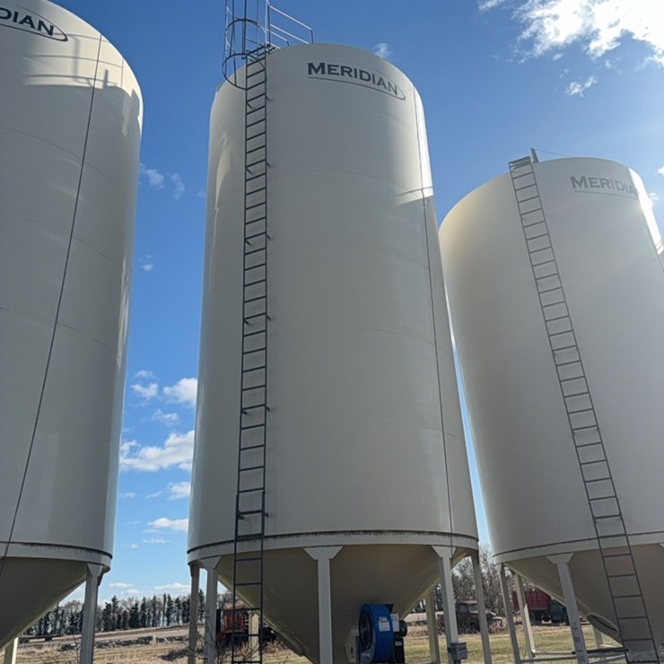 Meridian 6000 bushel hopper bin with fan, used for grain only, excellent shape