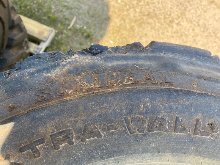 #7067-•-(4)-12-16.5-skid-steer-tires-on-rims-(deerbrook,-wi)-image-6