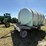 nurse-trailer-hayrack-w/-2,550-gal-poly-water-tank-image-1
