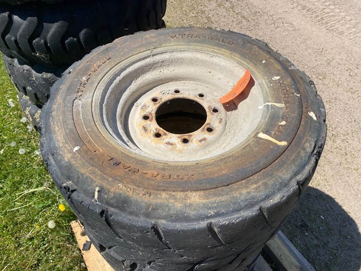 #7067-•-(4)-12-16.5-skid-steer-tires-on-rims-(deerbrook,-wi)-image-4