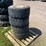 #7067-•-(4)-12-16.5-skid-steer-tires-on-rims-(deerbrook,-wi)-image-3