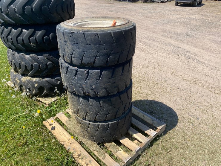 #7067-•-(4)-12-16.5-skid-steer-tires-on-rims-(deerbrook,-wi)-image-3